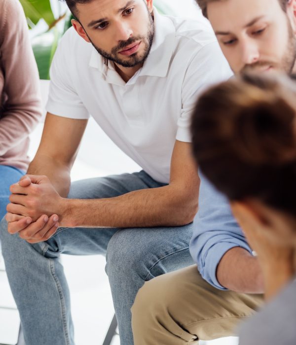 selective-focus-of-men-sitting-during-group-therapy-session.jpg